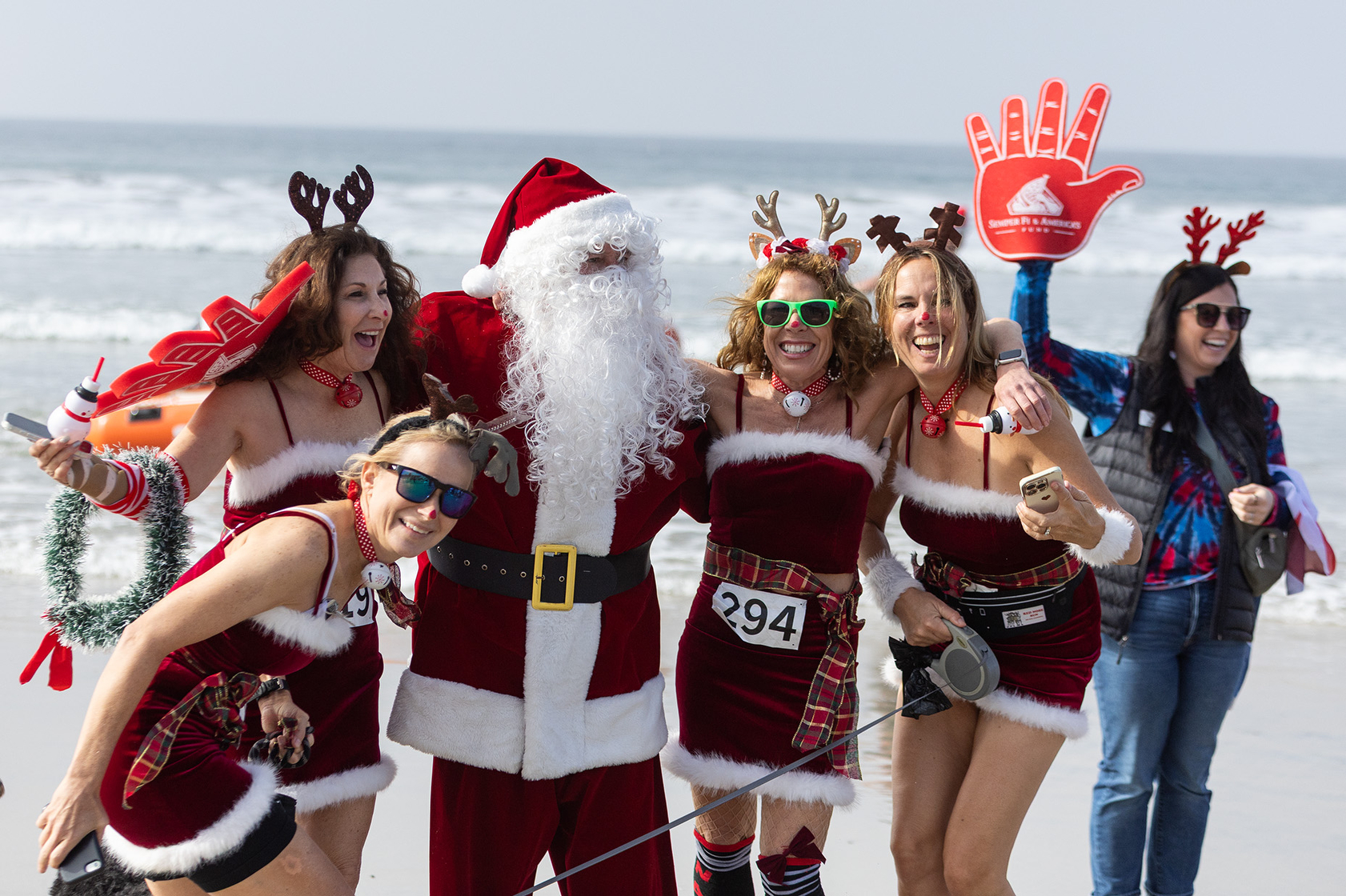 Santa is greeted by Lauren Essex, Elaine Raymond, Kim Duke,...