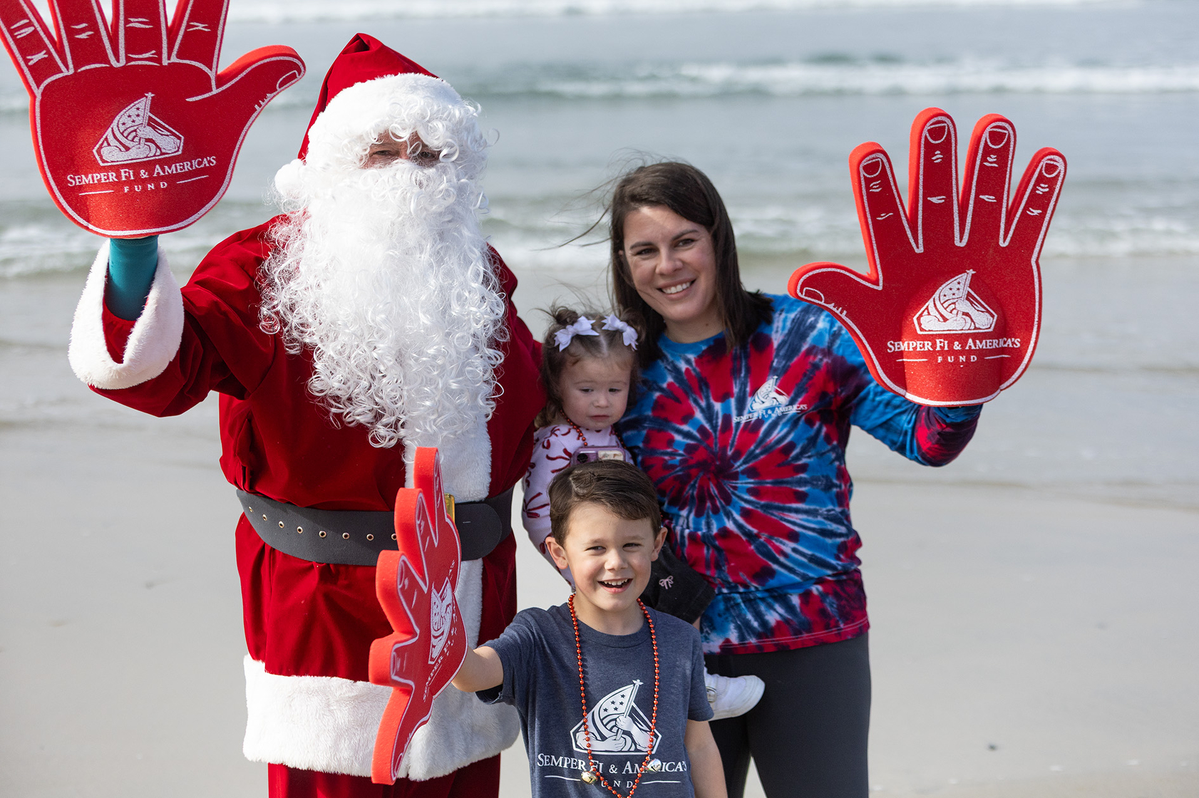 Race participants greet Santa at the Red Nose Run (Jon...