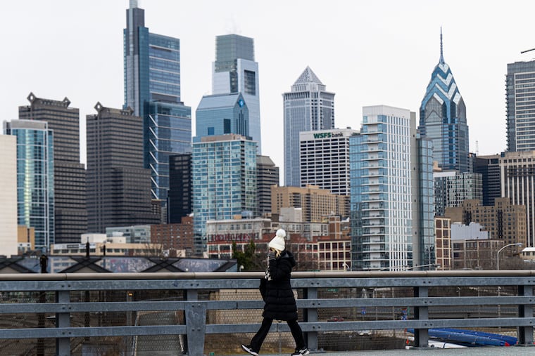 A pedestrian walks walks along the South Street bridge on a cold winter day last week.