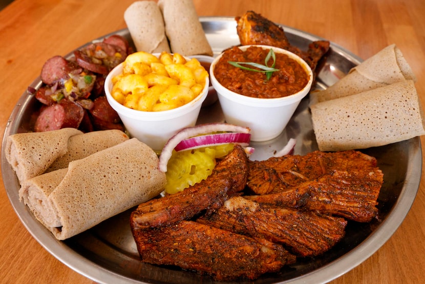 A barbecue plate of brisket, sausage and chicken seen at Smoke'N Ash BBQ in Arlington....