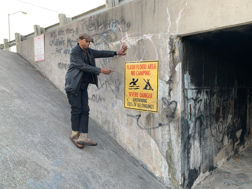 Charlie Brown and the sign Garrett Boone had made to warn people of the dangers that come...