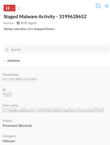 Screenshot of Cortex XDR alert. Some information is redacted. The execution of a dropped binary is blocked and the alert is categorized as malware. 
