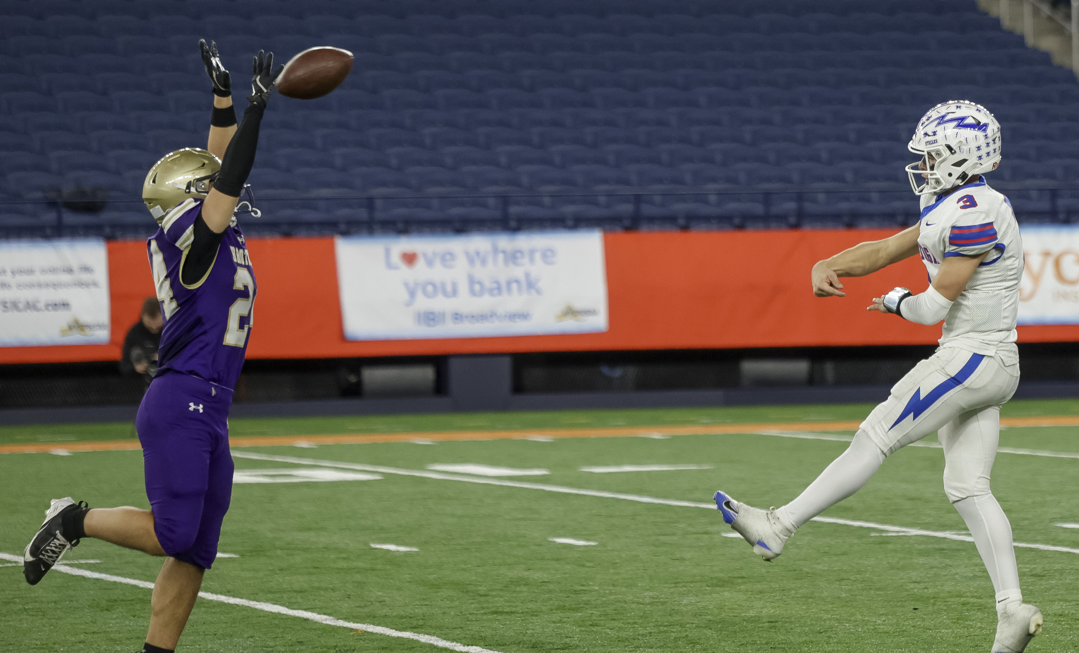 CBA Brothers linebacker Christian Giannone (24) blocks a pass by quarterback Saratoga Springs Blue Streaks Robert Morris (3) as the CBA Brothers and Saratoga Springs Blue Streaks fought for the New York State Class AA state title at JMA Wireless Dome Saturday, December 6, 2025. (N. Scott Trimble | strimble@syracuse.com)