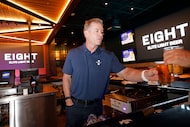 Former Dallas Cowboys quarterback Troy Aikman is seen at the bar area after speaking about...