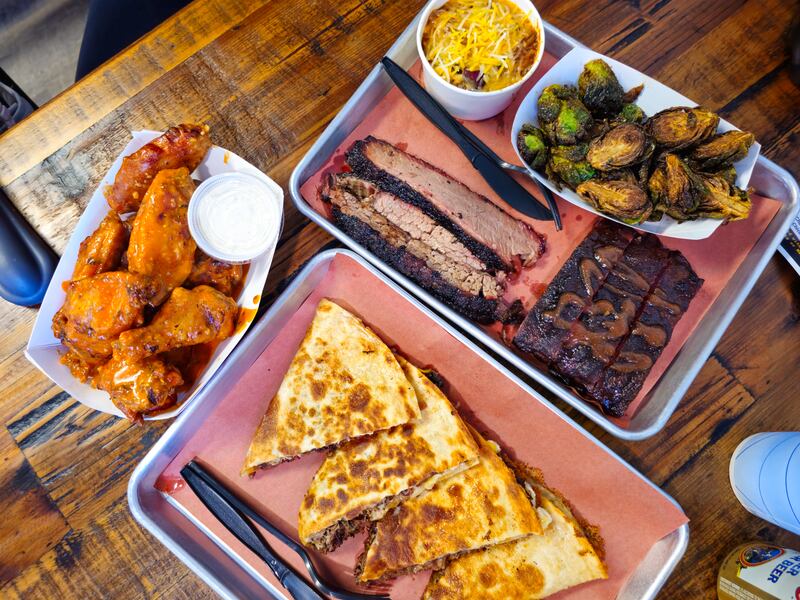Buffalo garlic parm smoked chicken wings, brisket "macadilla" and a two-meat platter with brisket and ribs from Angry Pig BBQ,  2935 Lamson Road, Phoenix.