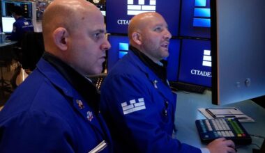 Wall Street drifts near its record high as Exxon Mobil climbs