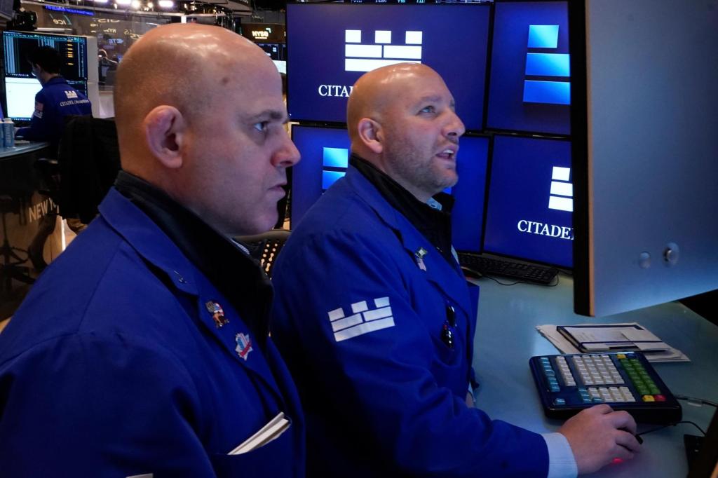 Wall Street drifts near its record high as Exxon Mobil climbs