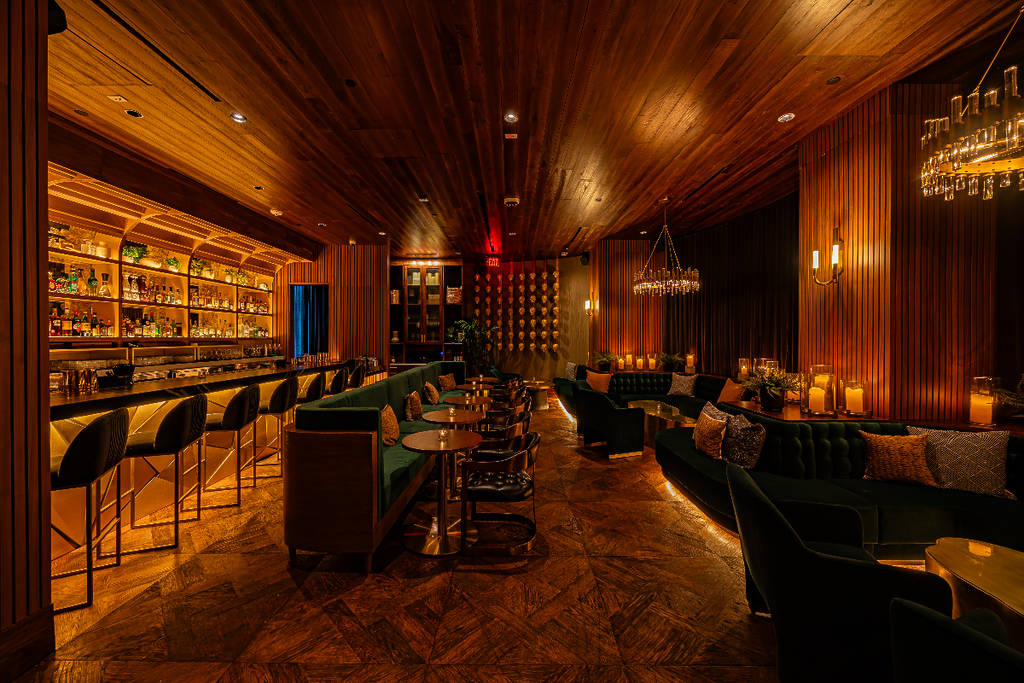 Image shows the dining space and bar area of Toca Madera in Houston.