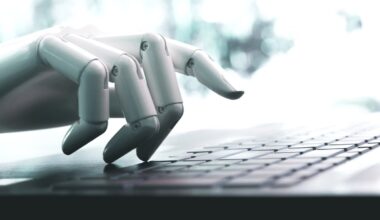 Robot concept or robot hand chatbot pressing computer keyboard enter