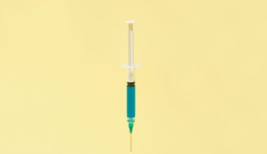 A floating syringe on a yellow background