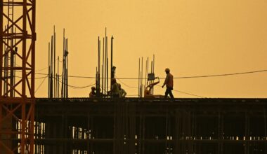 Men work at under construction site in New Delhi