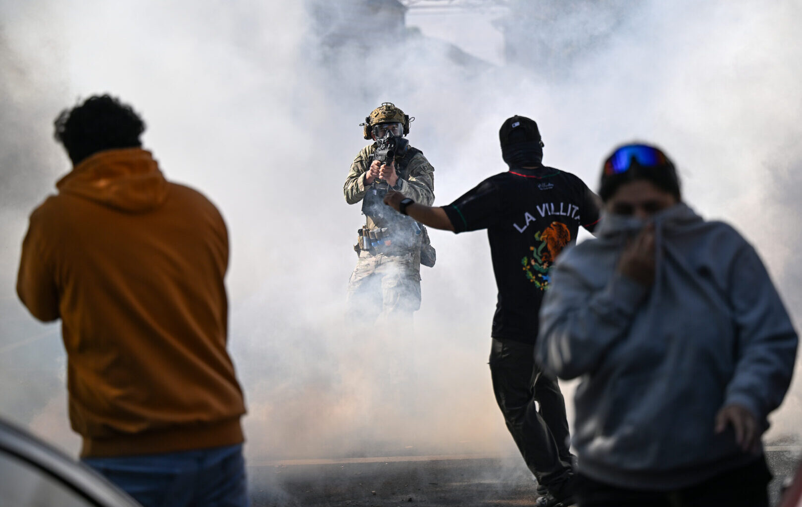 Residents and protesters clash with federal agents in the East Side neighborhood on Oct. 14, 2025 in Chicago.