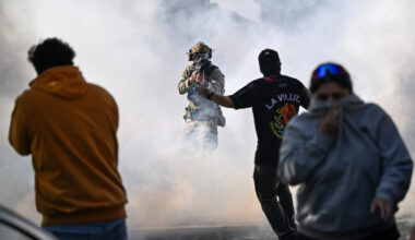 Residents and protesters clash with federal agents in the East Side neighborhood on Oct. 14, 2025 in Chicago.