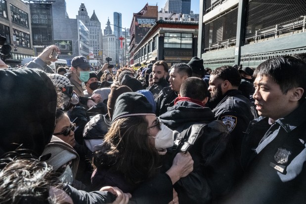 Immigration activists block a Lafayette Street garage being used by ICE vans during a protest against a purported ICE raid on Canal Street on Saturday.