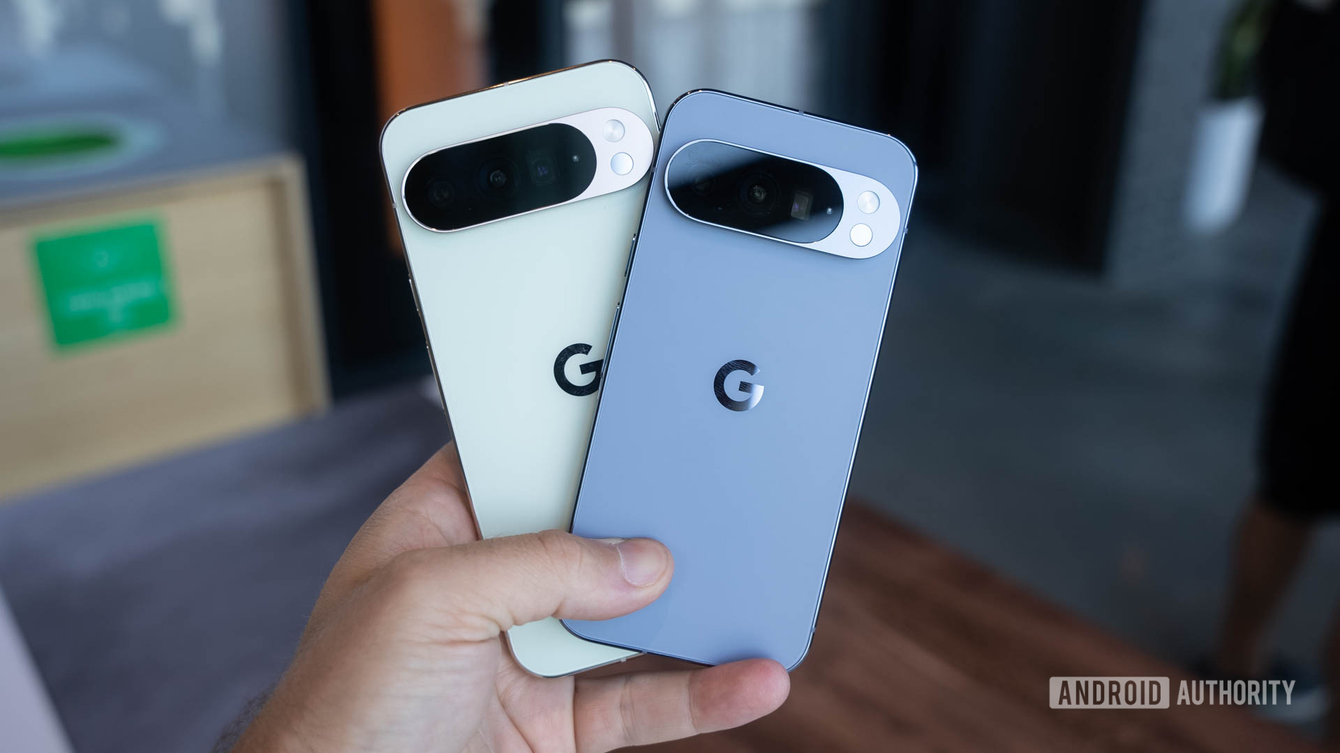 Google Pixel 10 Pro in Moonstone and Google Pixel 10 Pro XL in Jade fanned in man's hand