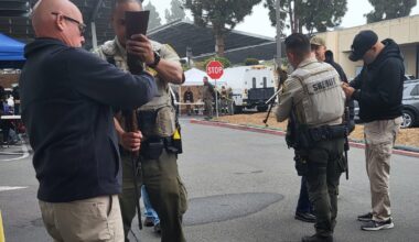 parole agents assist sheriff's office deputies in a gun safety buyback program in San Diego.