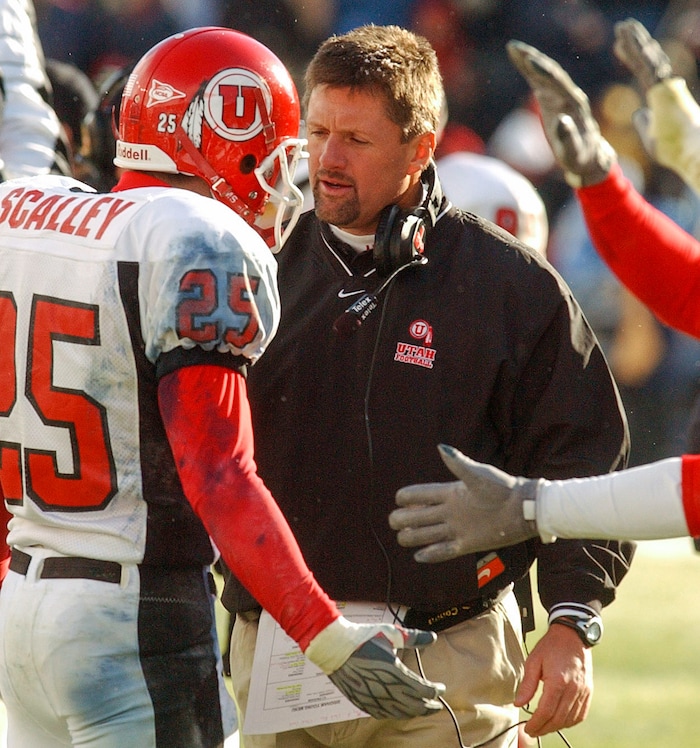 (Rick Egan | The Salt Lake Tribune) Kyle Whittingham coaches then-safety Morgan Scalley during a game against BYU in Provo in 2003.