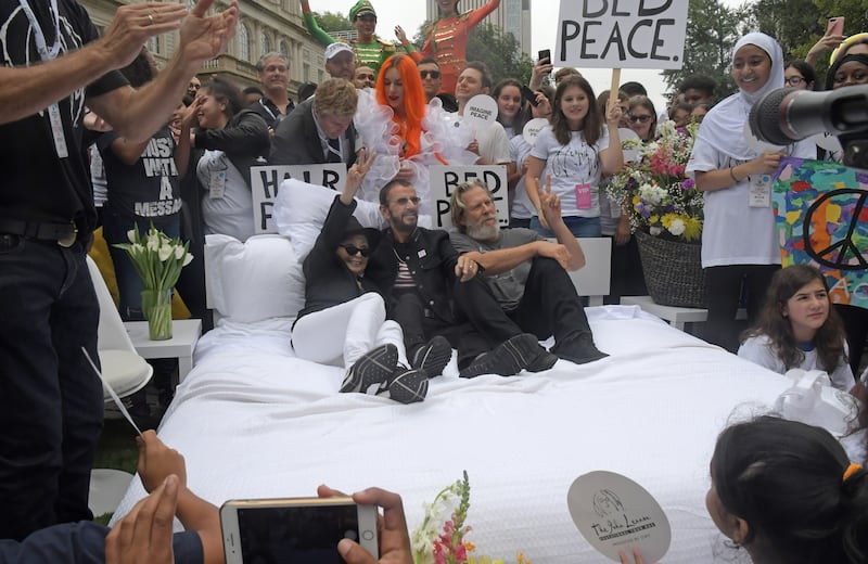 New York, N.Y.: Yoko Ono, Ringo Star and Jeff Bridges participate in a "Bed In" in front of City Hall in New York City to encourage student activism in honor of John Lennon on  Sept. 13, 2018, in New York.