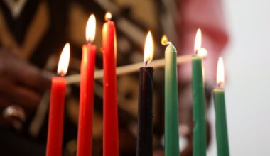 The kinara is lit during the candle lighting ceremony at Omega Psi Phi Fraternity Inc. on Saturday, Dec. 27, 2025, in Philadelphia. The kinara is a seven-branched candleholder that symbolizes the seven principles of Kwanzaa.