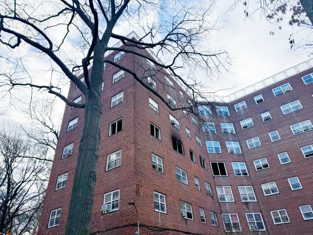A blaze broke out on the fourth floor of this Bronx apartment building, killing a 70-year-old man, authorities said. (Sheetal Banchariya / New York Daily News)