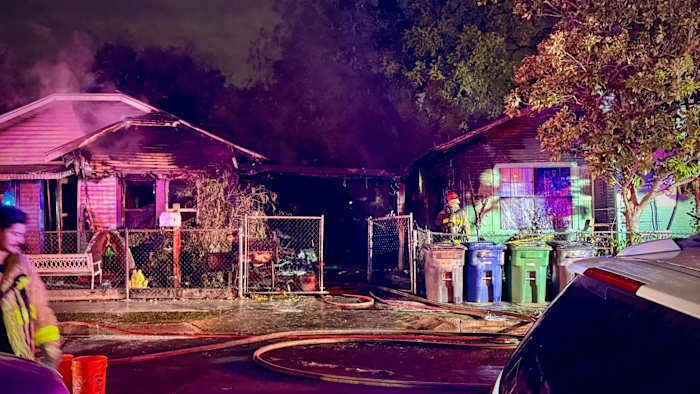 Two West Side homes damaged in fire that began under carport