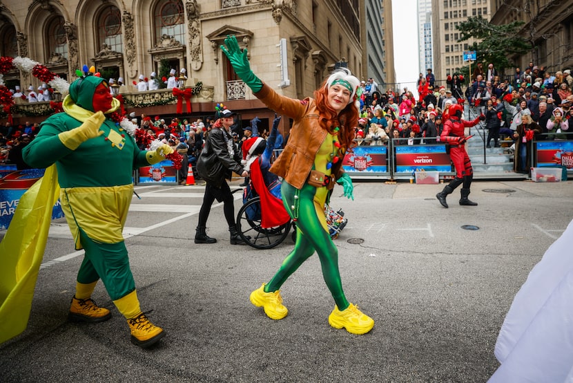 Wanda Vision (center) waves with the Avengers Initiative during the Dallas Holiday Parade on...
