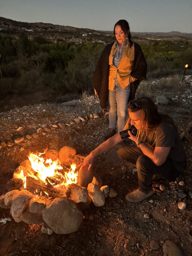 Filmmaker Eric Wolfinger sets up a shot by a campfire with Lisa Dahl for the documentary "Lisa Dahl: Blessed by Grace." (JP Cutler Media)