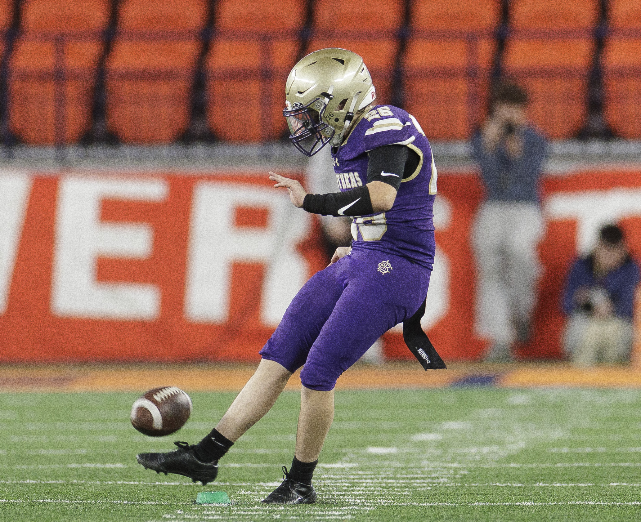 CBA Brothers place kicker Xavier Burdick (26) kicks off as the CBA Brothers and Saratoga Springs Blue Streaks fought for the New York State Class AA state title at JMA Wireless Dome Saturday, December 6, 2025. (N. Scott Trimble | strimble@syracuse.com)
