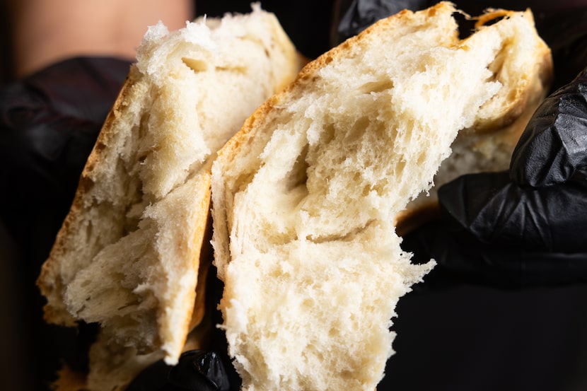 Carmen Romero shows the inside of the birote bread for the tortas at Tortas Ahogadas...