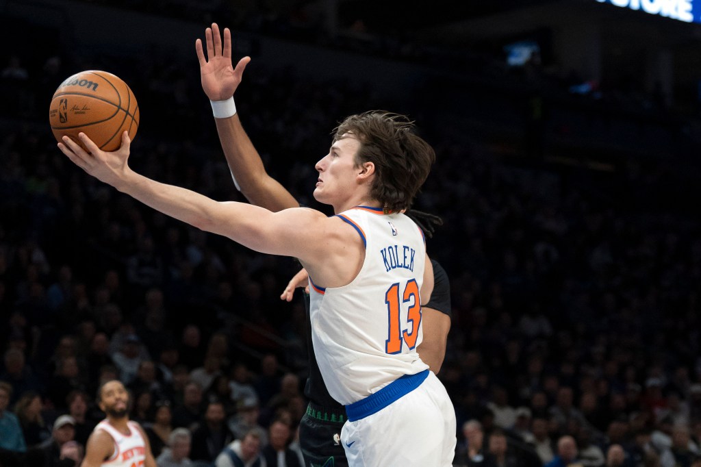 New York Knicks guard Tyler Kolek (13) shoots the ball over Minnesota Timberwolves guard Terrence Shannon Jr. (1) in the first half at Target Center. 