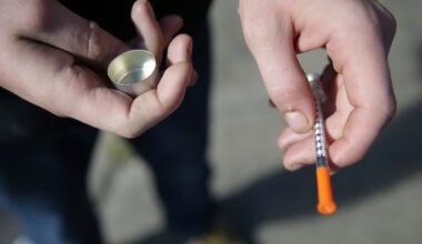 In this Oct. 22, 2018 file photo, a fentanyl user holds a needle near Kensington and Cambria in Philadelphia. Overdose deaths decreased in Philadelphia and statewide in 2024 and are on track to drop again in 2025.