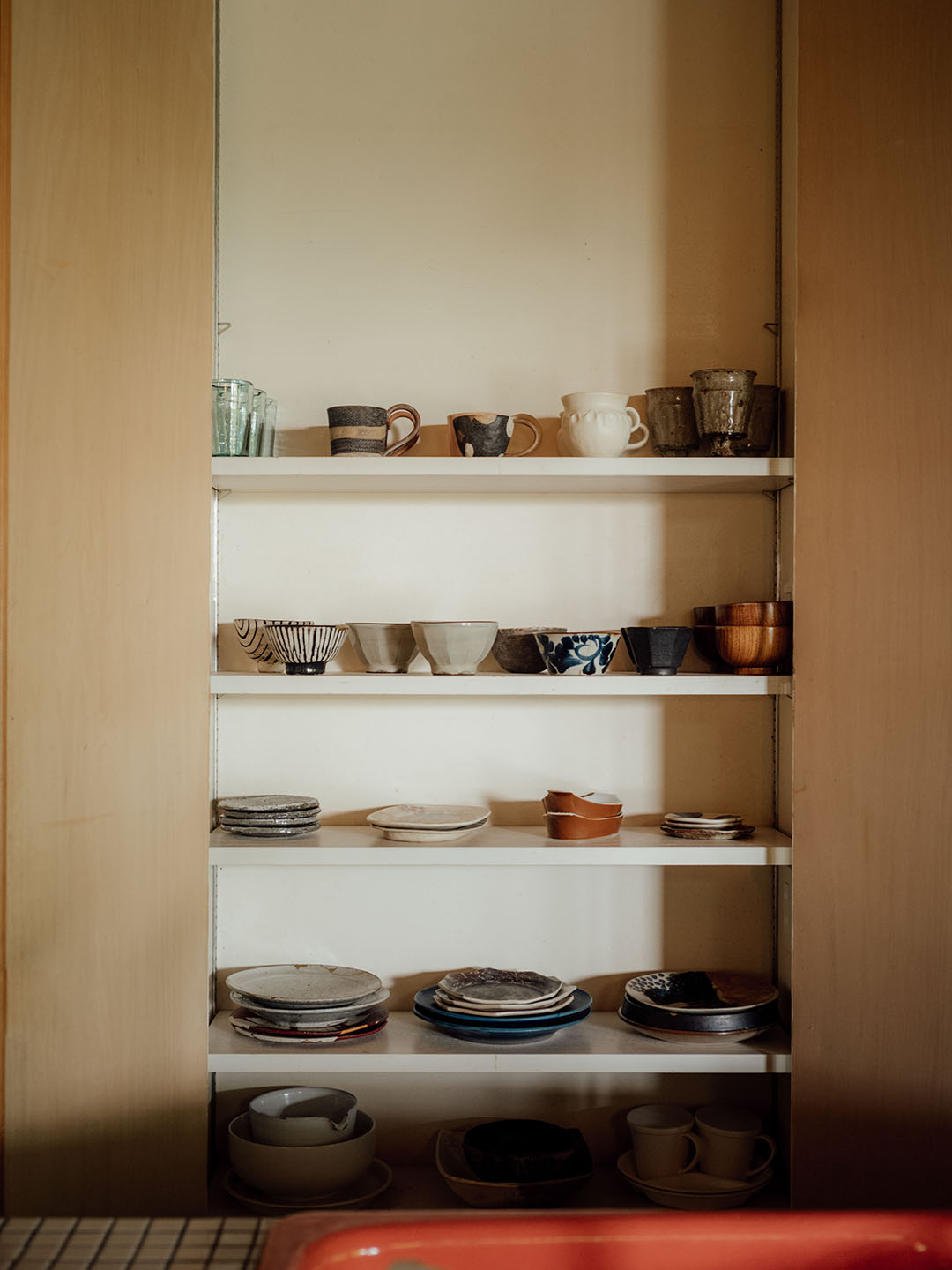 ceramic plates in kitchen shelves