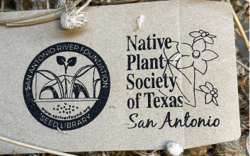Cardboard sign that says Native Plant Society of Texas San Antonio