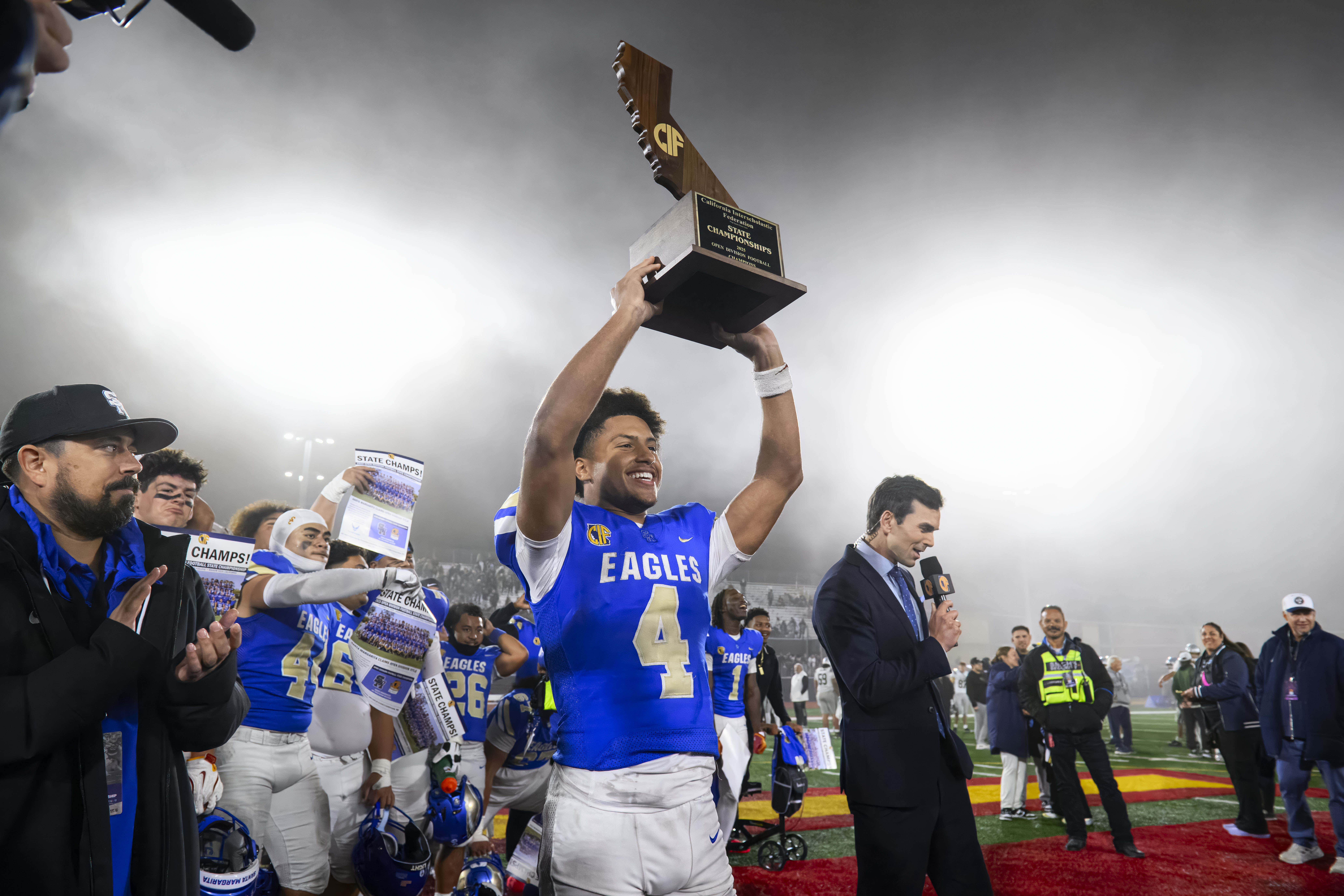 Santa Margarita wide receiver Trent Mosley holds up the CIF...