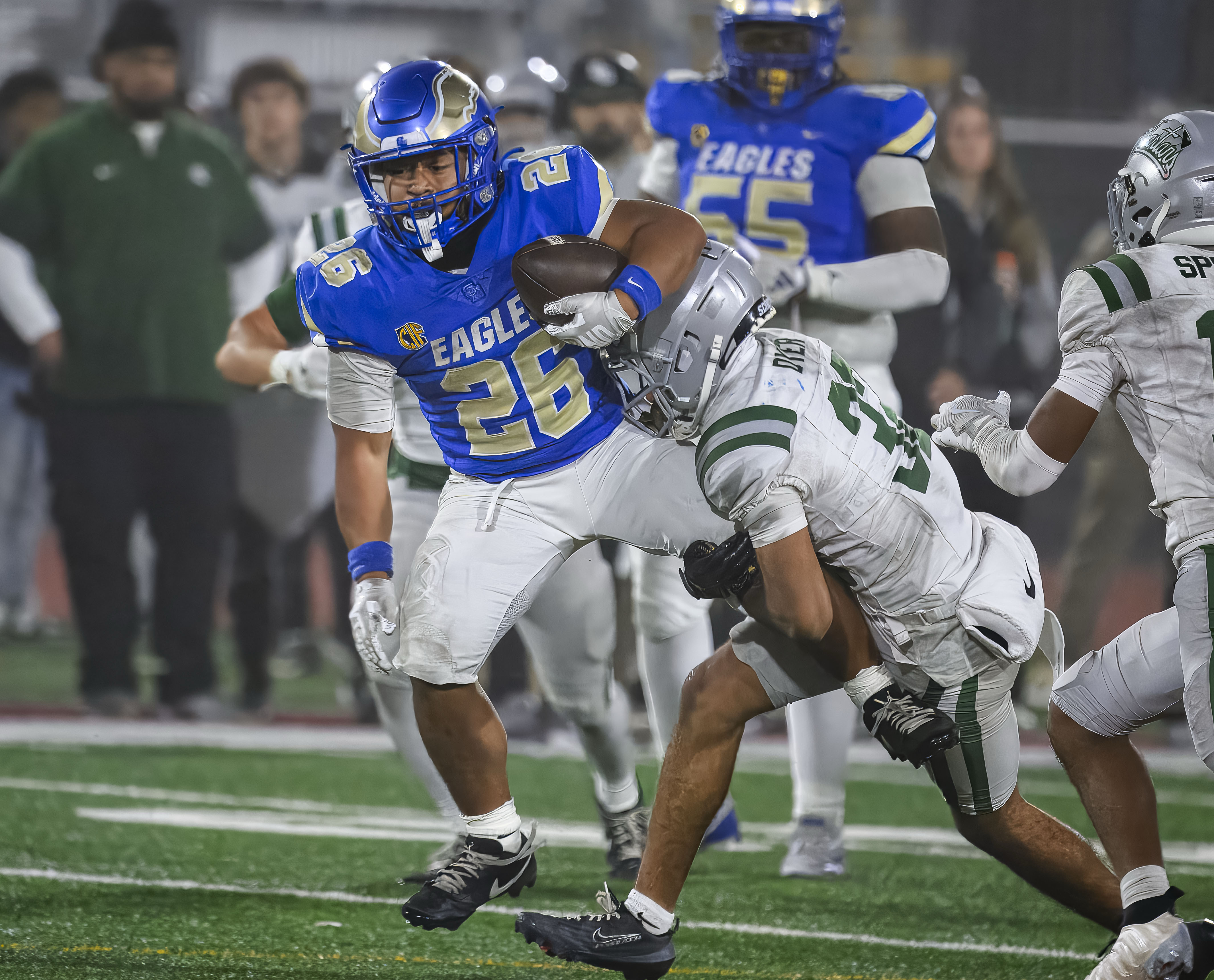 Santa Margarita running back Adrian Petero, left, pulls along De...