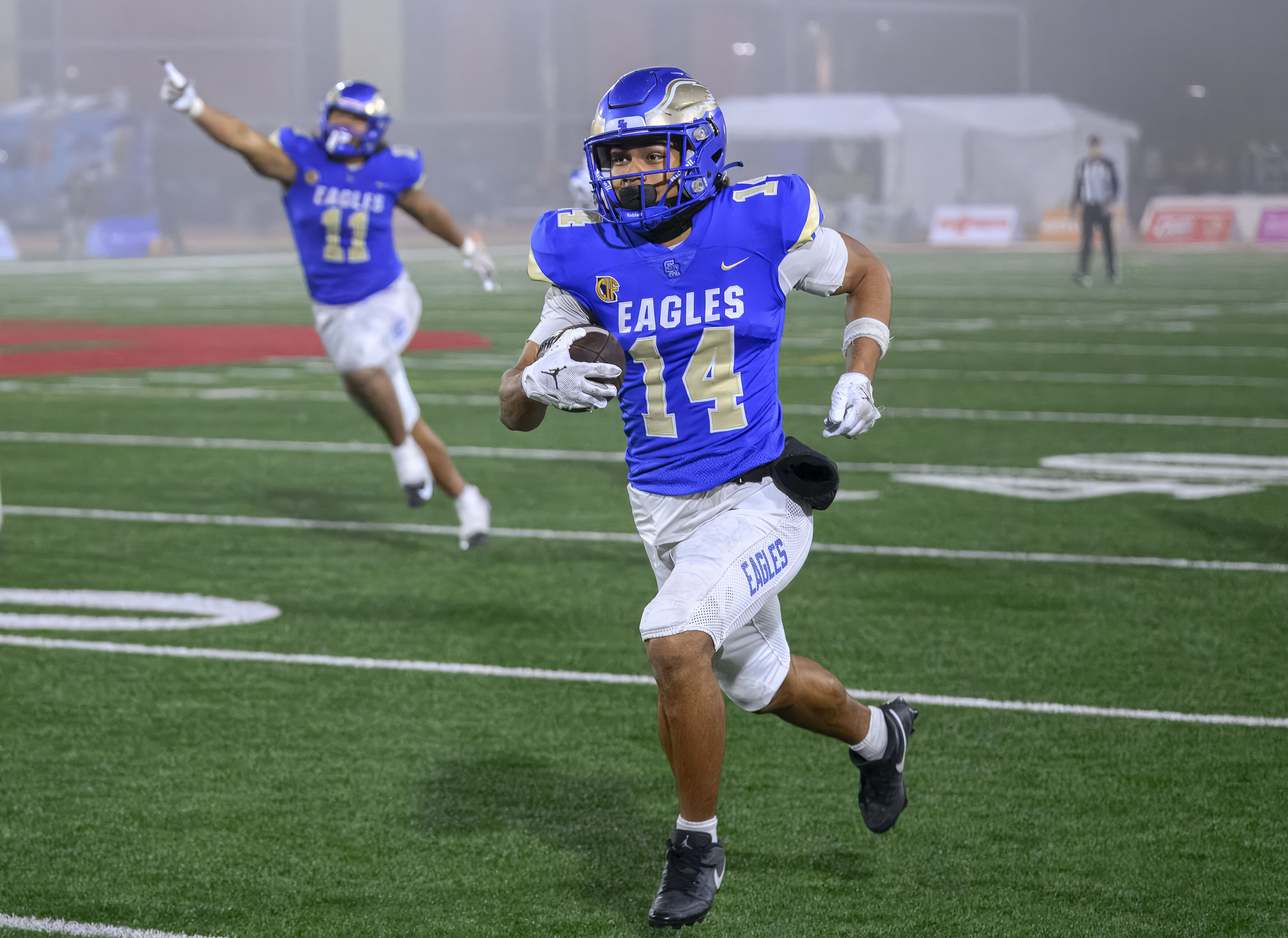 Santa Margarita defensive back Siua Holani runs to the end...