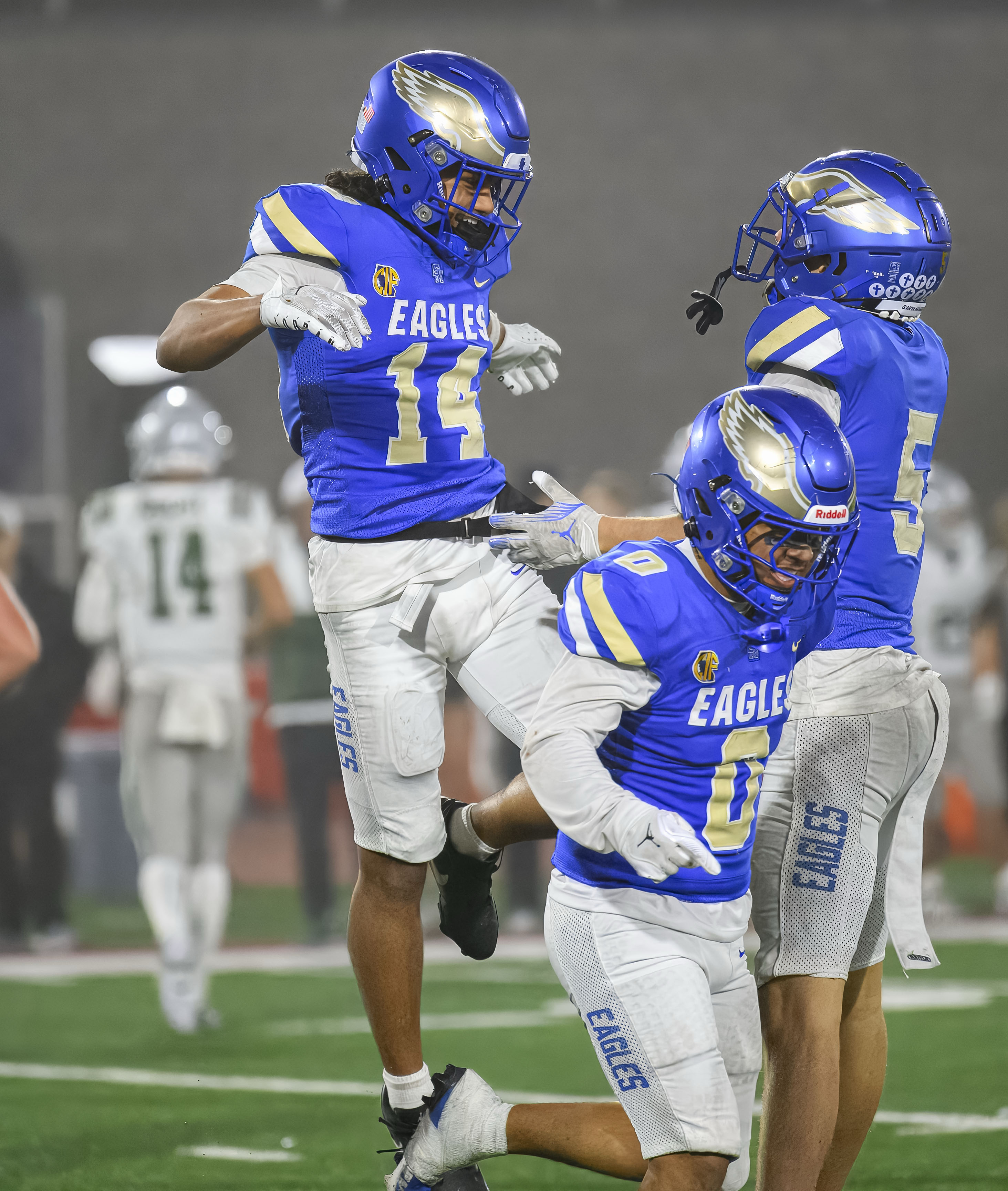 Santa Margarita defensive back Siua Holani, left, celebrates his pick...