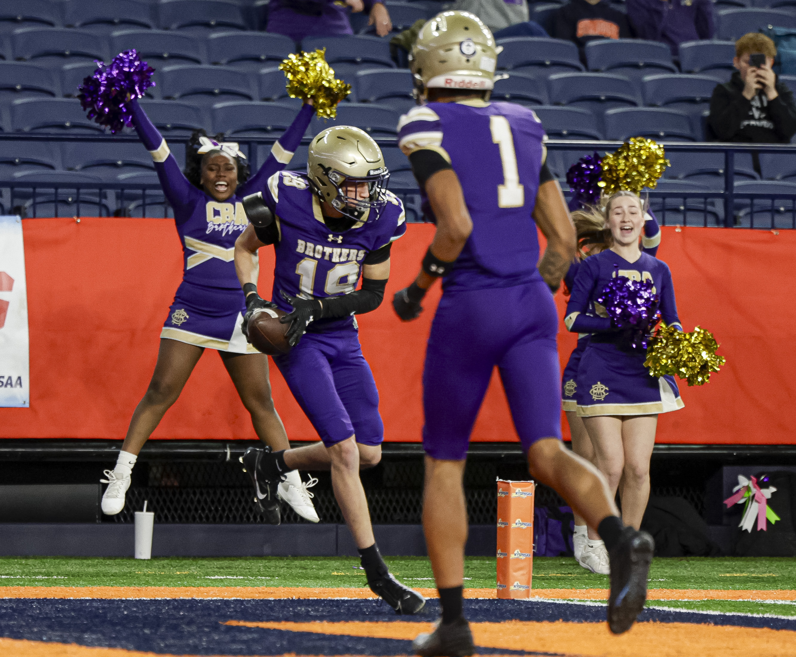 CBA Brothers wide receiver Braydon Johnson (19) scores a touchdown as the CBA Brothers and Saratoga Springs Blue Streaks fought for the New York State Class AA state title at JMA Wireless Dome Saturday, December 6, 2025. (N. Scott Trimble | strimble@syracuse.com)
