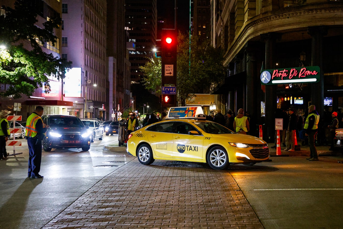 A New York City taxi drives off Ervay Street during filming for The Madison, an upcoming...