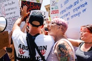 Abortion rights supporters and opponents clash while demonstrating in downtown Dallas on...