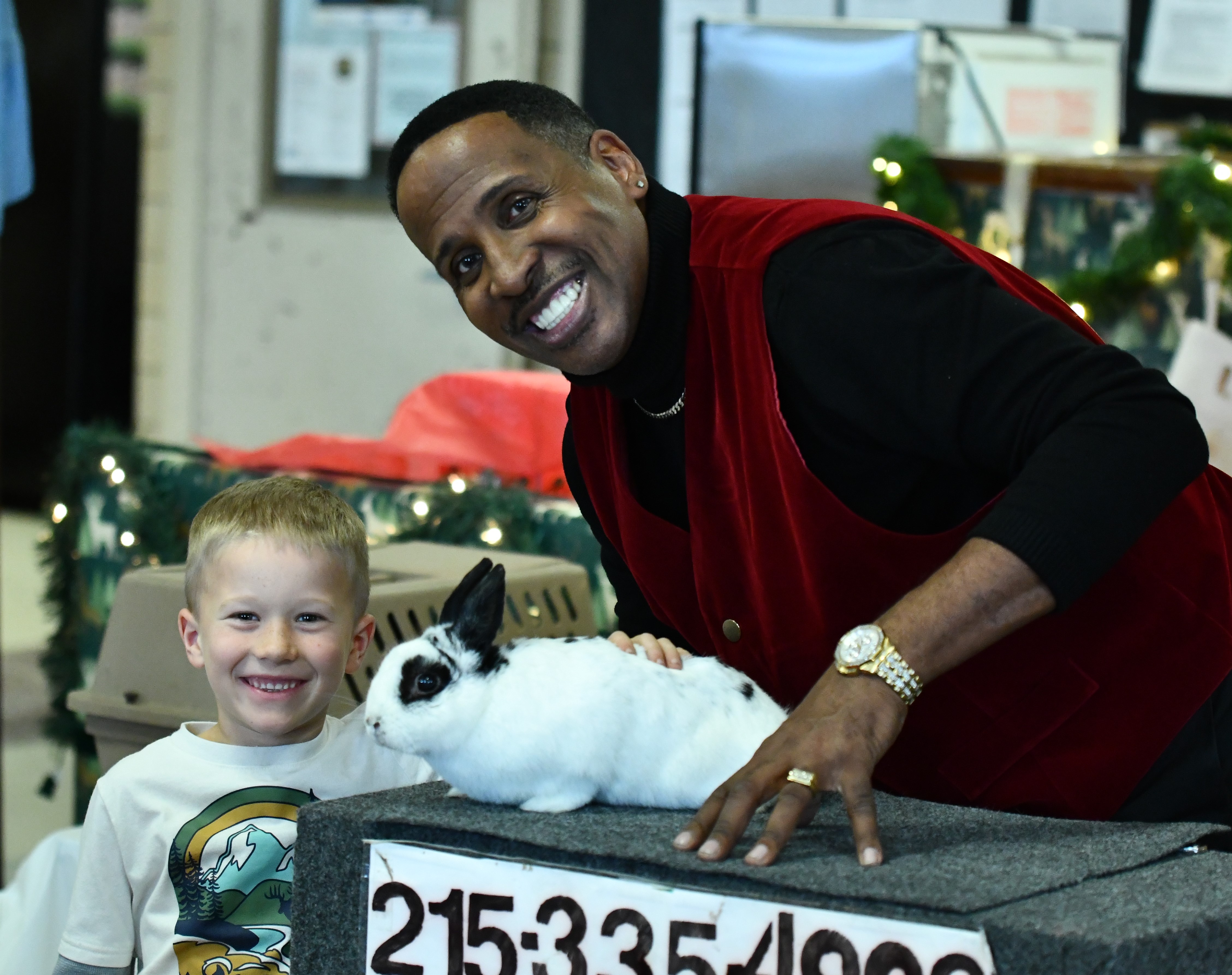 CW student Landon is all smiles as he cozies up...