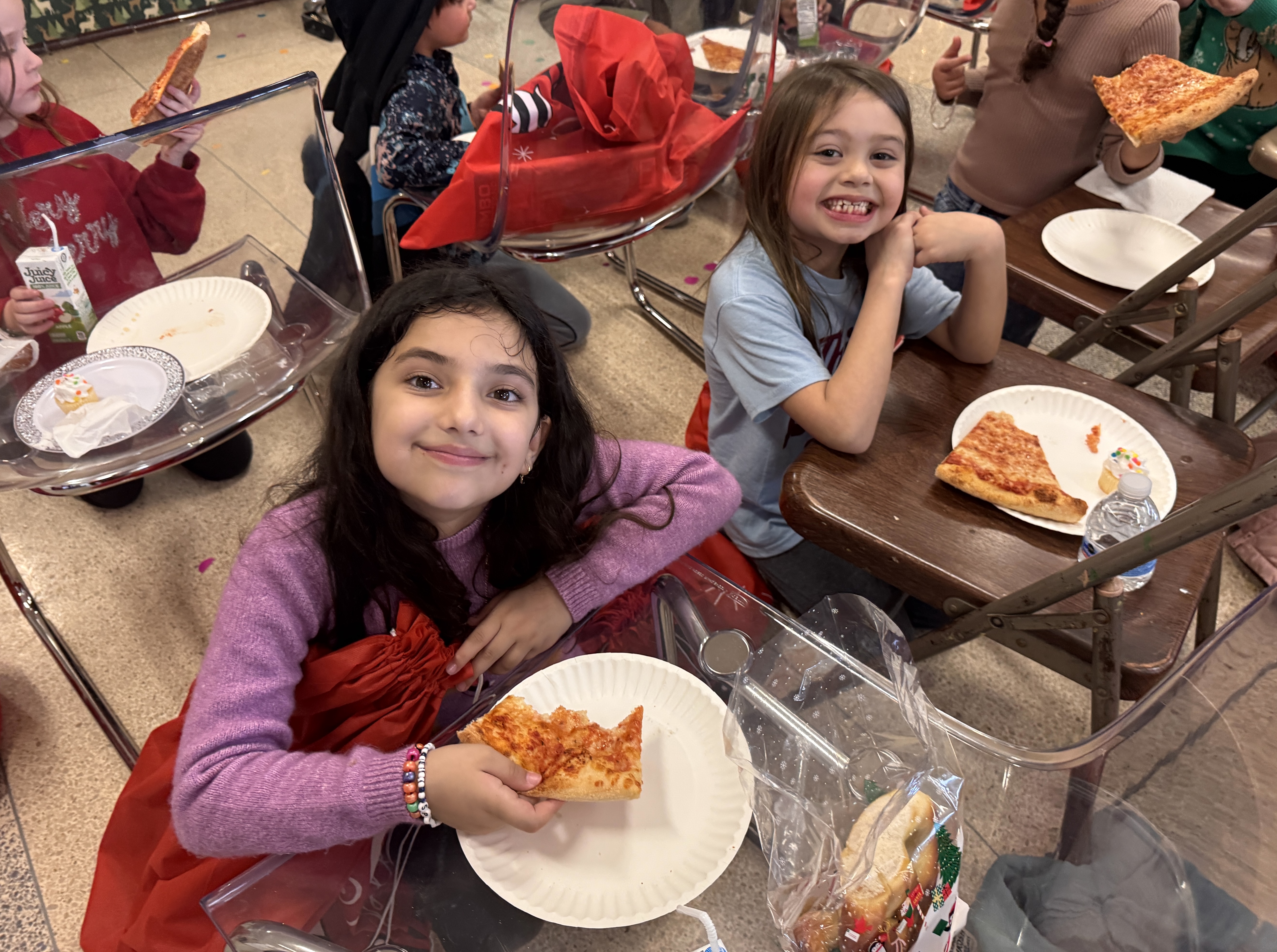 CW students Mursal and Bianca enjoy a couple of slices...