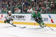Minnesota Wild center Joel Eriksson Ek (14) follows as Dallas Stars center Matt Duchene...