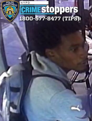 man wearing sweatshirt on a bus