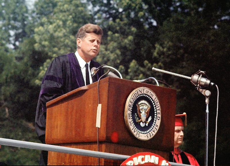 US President John F Kennedy  (1917 - 1963) speaks, outdoors, at American University's commencement ceremony, Washington DC, June 10, 1963.