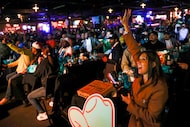 Attendees cheer for their favorite teams during the World Cup draw watch party on Friday,...