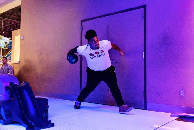 San Diego State center Ross Ulugalu-Maseuli joined teammates on Christmas Eve for a New Mexico Bowl for some bowling at Main Event Entertainment. (Justin Truong / SDSU Athletics)