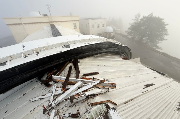 The Christmas Day storm that brought winds of 110 mph to the top of Mt Hamilton where the James Lick Observatory sits brought down the 60-foot crescent steel door that once covered half the dome's vertical opening. The door landed onto an adjoining building where it broke windows and splintered attic beams.  (Photo by Jamey Eriksen/UCSC Lick Observatory)