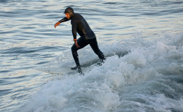 Ricardo Urbina of Aptos surfs on the SwellCycle Lava by Spina Surfboards during a SwellCycle demo day at Steamer Lane in Santa Cruz on Monday, Oct. 20, 2025. (Nhat V. Meyer/Bay Area News Group)