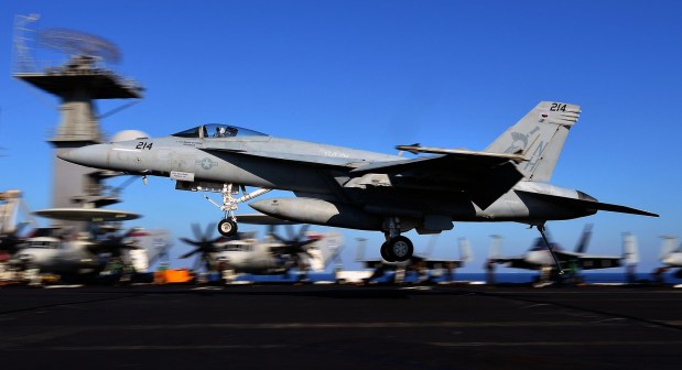 An F/A-18E Super Hornet takes off from the flight deck of the USS Nimitz (CVN 68) aircraft carrier in the Mediterranean Sea on October 24, 2013. The US aircraft carrier, which had been on standby in case of a flare up in Syria, has left the Red Sea for a brief stint in the Mediterranean Sea. AFP PHOTO / ALBERTO PIZZOLI (Photo credit should read ALBERTO PIZZOLI/AFP via Getty Images)